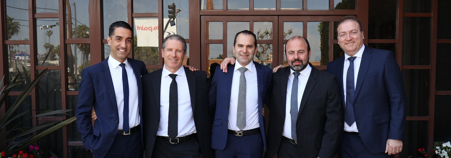 hinden & breslavsky team standing in front of their office